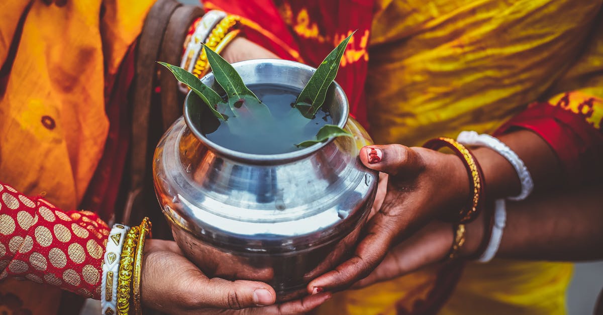 No water in the Crock pot - People Holding Silver Metal Pot No water in the Crock pot - People Holding Silver Metal Pot