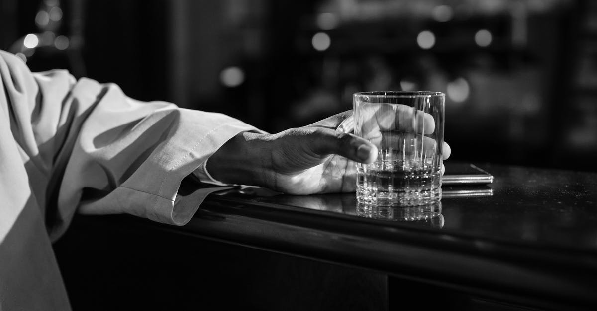 Non-alcoholic substitute for brandy? - Close-Up Photo of Person Holding Clear Drinking Glass Non-alcoholic substitute for brandy? - Close-Up Photo of Person Holding Clear Drinking Glass