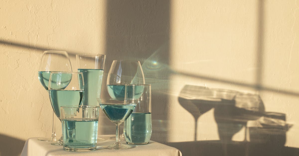 Nonalcoholic Substitute for Marsala Wine - Blue alcoholic drink in glasses on table Nonalcoholic Substitute for Marsala Wine - Blue alcoholic drink in glasses on table