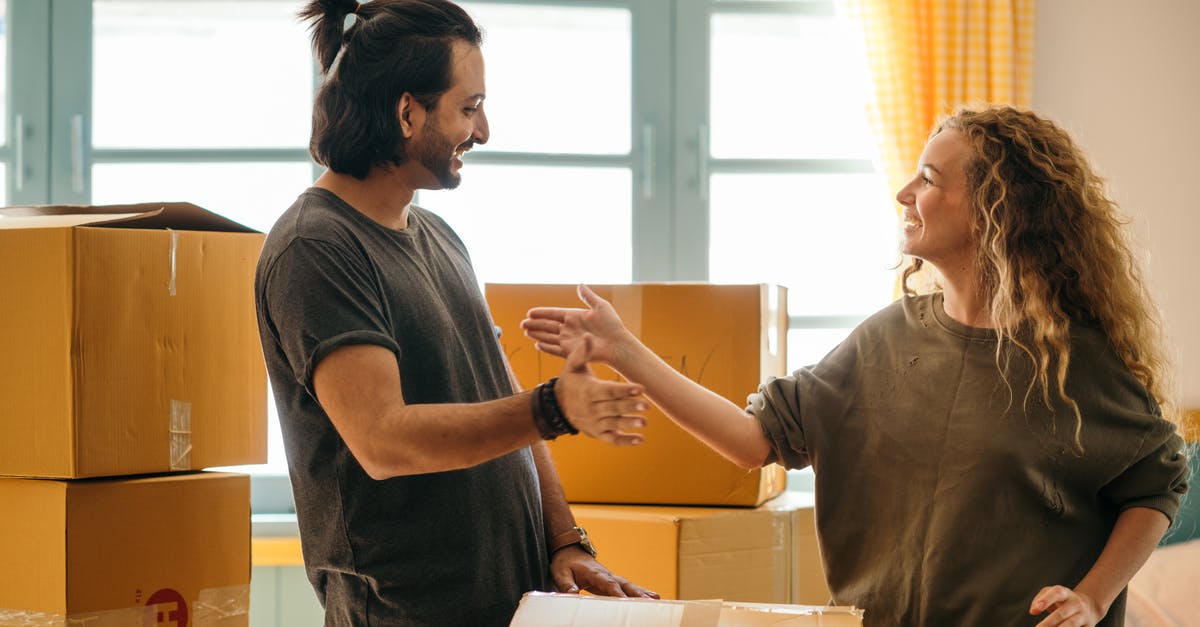 Non-Quick Cooking Couscous - Is that a real thing anywhere? - Happy diverse couple among carton boxes in new home Non-Quick Cooking Couscous - Is that a real thing anywhere? - Happy diverse couple among carton boxes in new home