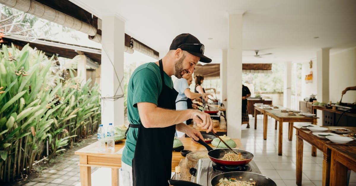 Nonstick pans blistering after dishwasher? - A Man Wearing Black Apron Cooking Food in a Cooking Competition Nonstick pans blistering after dishwasher? - A Man Wearing Black Apron Cooking Food in a Cooking Competition