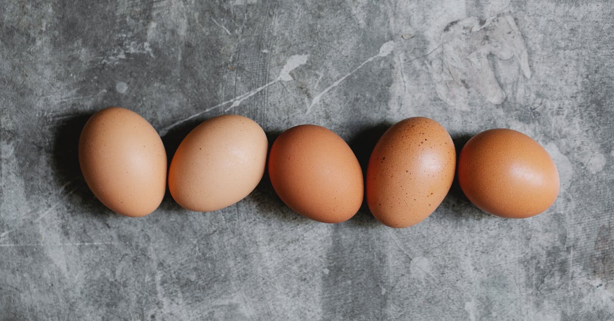 Nutritional value of brown particles settled at the bottom of chicken bone broth - Whole raw brown eggs arranged on table in kitchen Nutritional value of brown particles settled at the bottom of chicken bone broth - Whole raw brown eggs arranged on table in kitchen