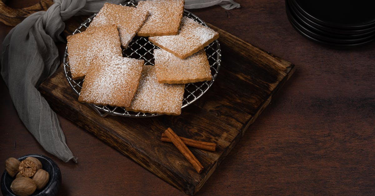 Nuts and raisins don't stick to cookies after baking - Biscuits on Mesh Wire and Cinnamon Sticks Nuts and raisins don't stick to cookies after baking - Biscuits on Mesh Wire and Cinnamon Sticks