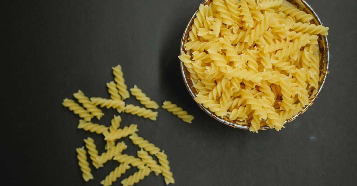 Of Vegetables that are spiralized how would you sort them from easy to difficult end of spectrum to Spiralize? - Heap of raw fusilli pasta on table