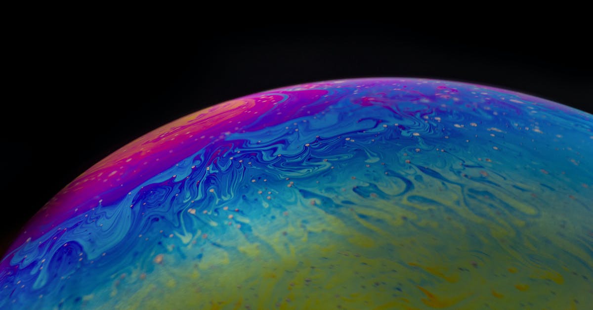 oil shimmering or just smoking? - Round multicolored abstract sphere on dark background oil shimmering or just smoking? - Round multicolored abstract sphere on dark background