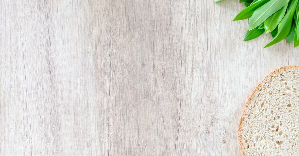 Olive wood cooking utensils: Seasoning, care, and maintenance? - Sliced Bread on Brown Wooden Board Olive wood cooking utensils: Seasoning, care, and maintenance? - Sliced Bread on Brown Wooden Board