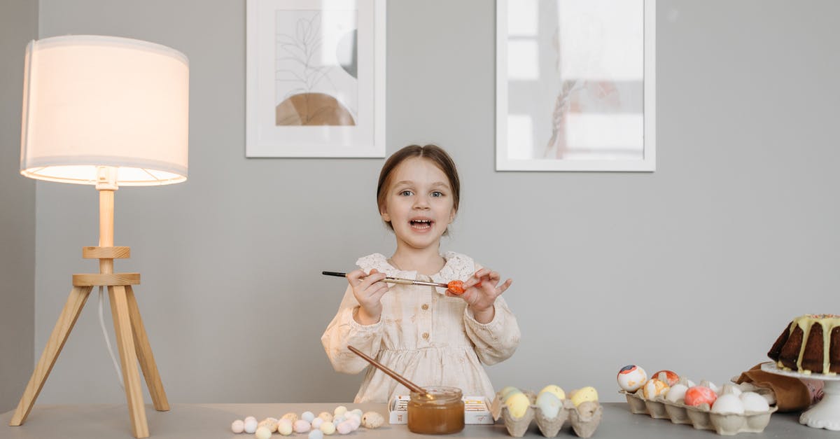 Once unwashed eggs have been refrigerated, must they remain so? - Little Girl Making Easter Eggs