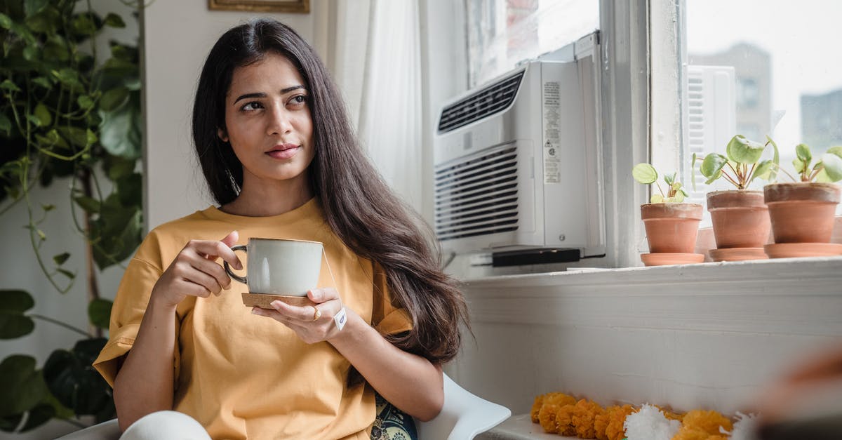 One Cup in Grams - Woman in White Shirt Holding White Ceramic Mug