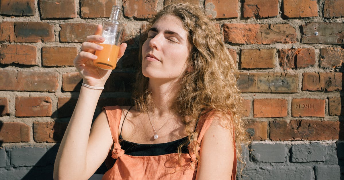 Orange juice preservation by chemical presevatives - Woman Drinking Juice from a BottleĀ Orange juice preservation by chemical presevatives - Woman Drinking Juice from a BottleĀ