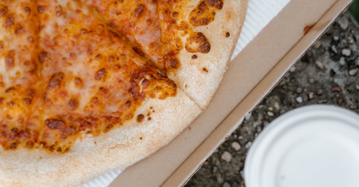 Order of ingredients when making Pizza dough - Brown and White Pizza on White Paper Plate Order of ingredients when making Pizza dough - Brown and White Pizza on White Paper Plate