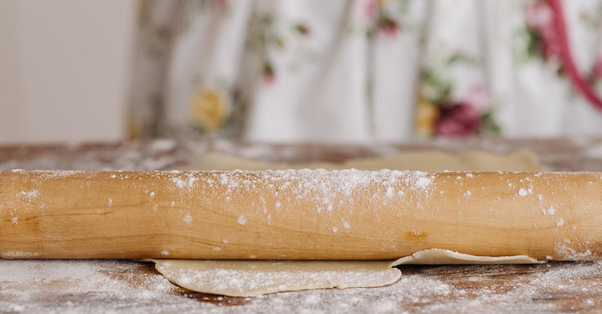 Over kneaded dough: what can I do with it? - Close-Up Shot of a Rolling Pin Over kneaded dough: what can I do with it? - Close-Up Shot of a Rolling Pin