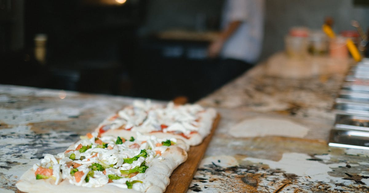 Overheating a pizza stone? - Brown and White Pizza on Brown Wooden Table Overheating a pizza stone? - Brown and White Pizza on Brown Wooden Table