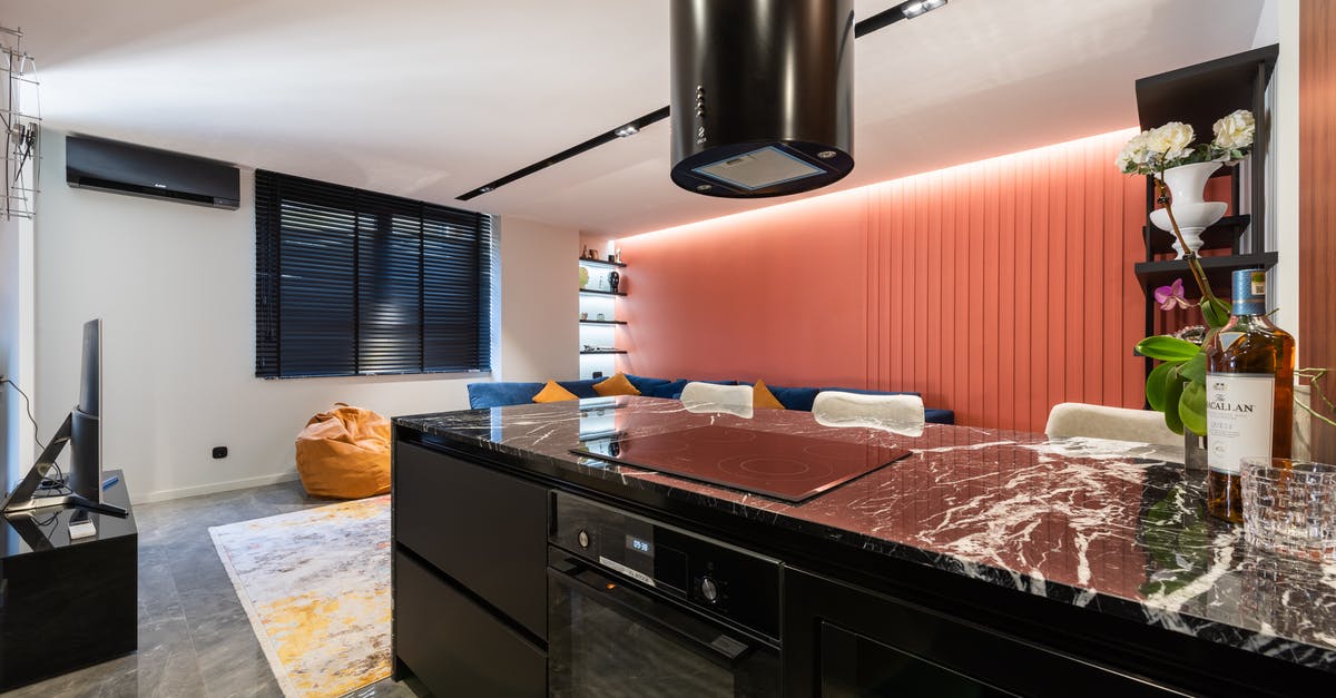 Overnight cooking: Is sous-vide safer than electrical oven? - Modern kitchen interior with hob under hood at home Overnight cooking: Is sous-vide safer than electrical oven? - Modern kitchen interior with hob under hood at home