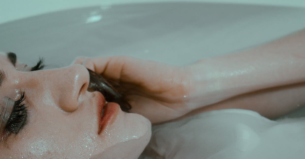 Pancetta leaking into cheesecloth - Sad woman with leaking mascara resting in bathtub Pancetta leaking into cheesecloth - Sad woman with leaking mascara resting in bathtub