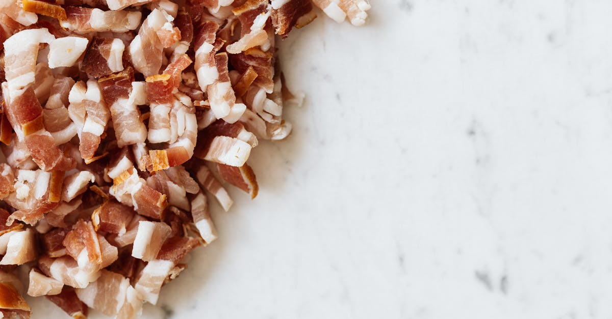 Pancetta Mold. How to tell whether it's safe to eat? - Heap of sliced bacon on marble surface Pancetta Mold. How to tell whether it's safe to eat? - Heap of sliced bacon on marble surface