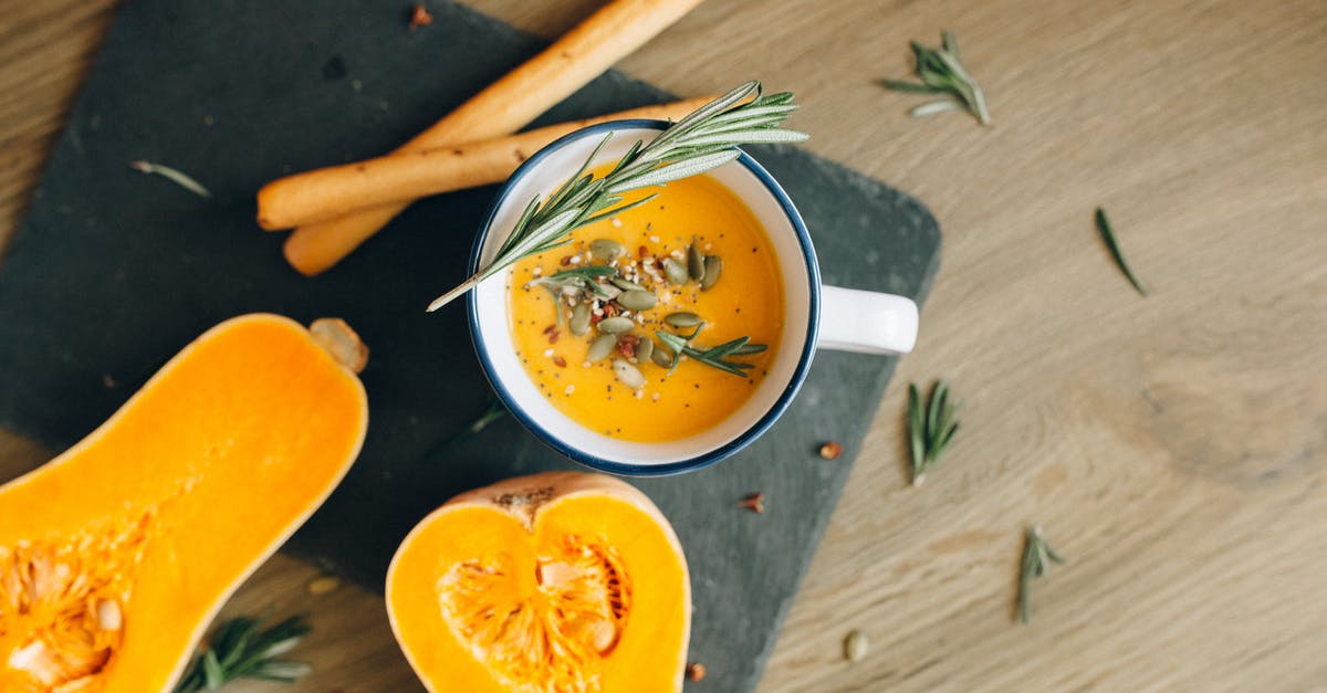 Papaya puree types - White Ceramic Bowl With Soup and Brown Wooden Chopsticks Papaya puree types - White Ceramic Bowl With Soup and Brown Wooden Chopsticks
