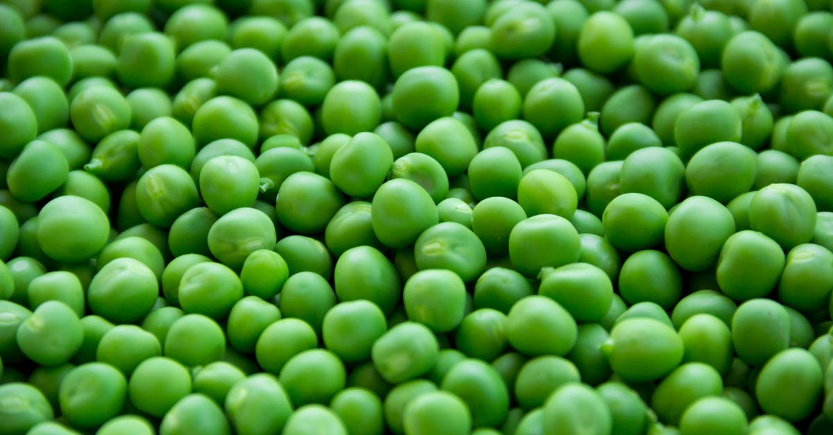 Parcooking carrots and green beans for an already well-seasoned casserole - Full Frame Shot of Green Peas Parcooking carrots and green beans for an already well-seasoned casserole - Full Frame Shot of Green Peas