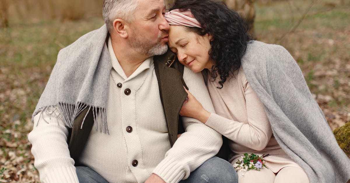 Parsley: flat-leaf or curly? - Happy senior couple hugging in autumn park Parsley: flat-leaf or curly? - Happy senior couple hugging in autumn park