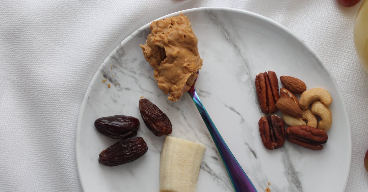 Peanut butter becomes dry - Nuts and Slices of Banana on White Ceramic Plate with Spoon of Peanut Butter Peanut butter becomes dry - Nuts and Slices of Banana on White Ceramic Plate with Spoon of Peanut Butter