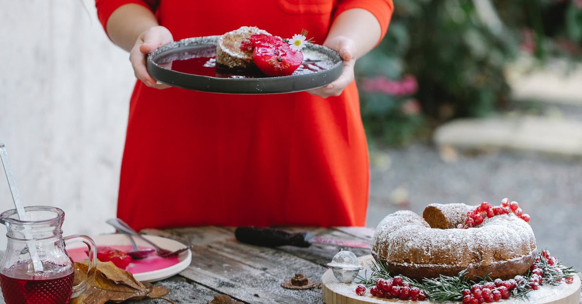 Pears caused uneven bake - how to stop this? - Crop unrecognizable female in red dress demonstrating plate with palatable homemade pie garnished with pear and chamomile flower while standing in backyard Pears caused uneven bake - how to stop this? - Crop unrecognizable female in red dress demonstrating plate with palatable homemade pie garnished with pear and chamomile flower while standing in backyard