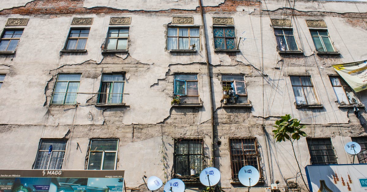 Peeling a Drumstick - Facade of an Old Apartment Building Peeling a Drumstick - Facade of an Old Apartment Building
