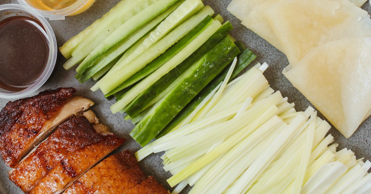 Peking Duck Sauce - Sliced Green Vegetable Beside Fried Duck Peking Duck Sauce - Sliced Green Vegetable Beside Fried Duck