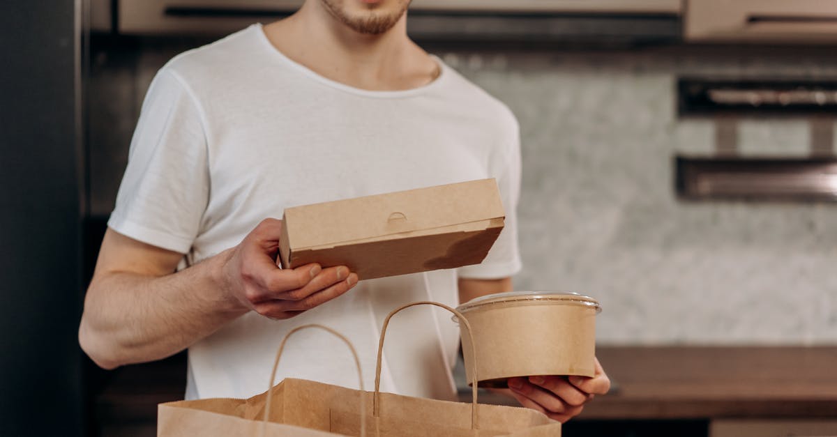 PET containers for freezer meals? - A Man in White Shirt Taking Out Food Delivery from the Bag PET containers for freezer meals? - A Man in White Shirt Taking Out Food Delivery from the Bag
