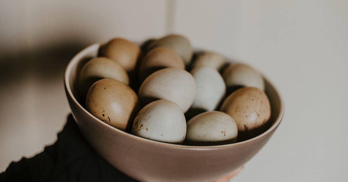Pickled Eggs with slightly gooey yolks? - Person Holding Bowl of Eggs Pickled Eggs with slightly gooey yolks? - Person Holding Bowl of Eggs