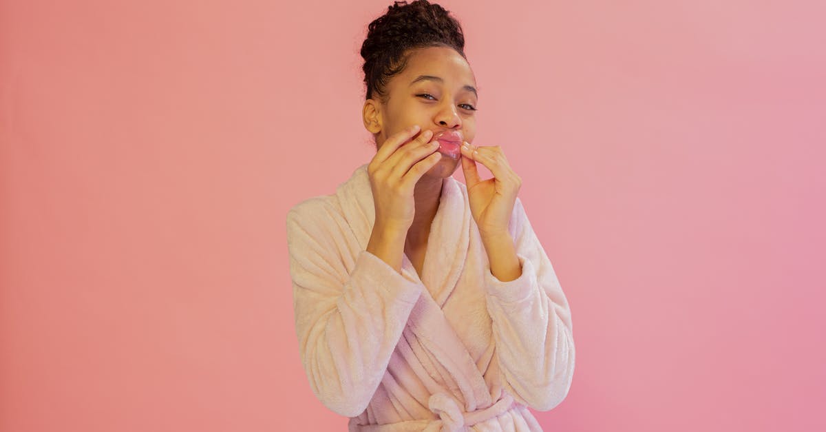 Pink Tinted Quinoa - Beautiful Woman in a Bathrobe in Pink Background Pink Tinted Quinoa - Beautiful Woman in a Bathrobe in Pink Background