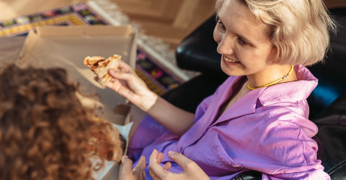 Pizza without yeast - Woman in Purple Button Up Shirt Holding Brown Bread Pizza without yeast - Woman in Purple Button Up Shirt Holding Brown Bread
