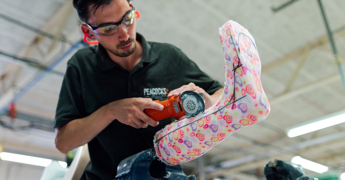 plastic cutting sheets. how to use properly - Man Using Handheld Cutter plastic cutting sheets. how to use properly - Man Using Handheld Cutter