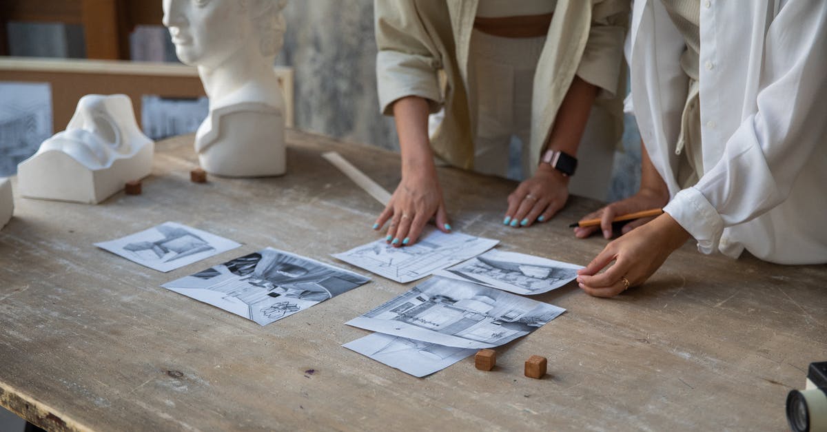 Polish Wheat Purchase - Person in White Button Up Shirt Sitting at Table With Newspaper Polish Wheat Purchase - Person in White Button Up Shirt Sitting at Table With Newspaper