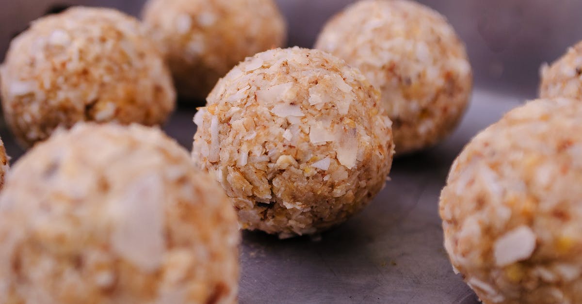 pork fillet cooking time - Uncooked round meatballs on metal tray pork fillet cooking time - Uncooked round meatballs on metal tray