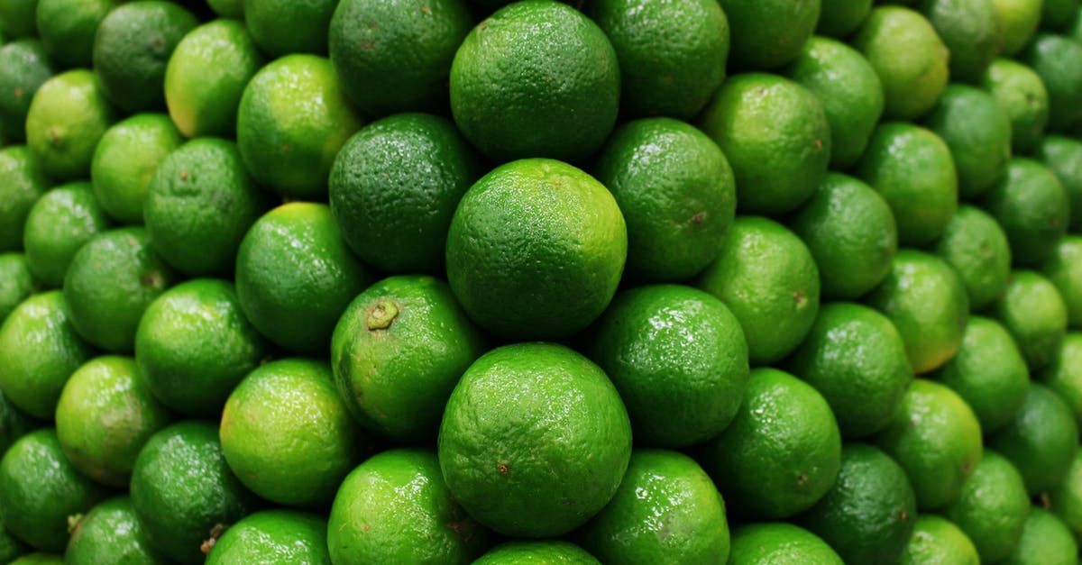 Post harvest treatment of organic limes vs conventional limes - Close-Up Shot of Limes Post harvest treatment of organic limes vs conventional limes - Close-Up Shot of Limes