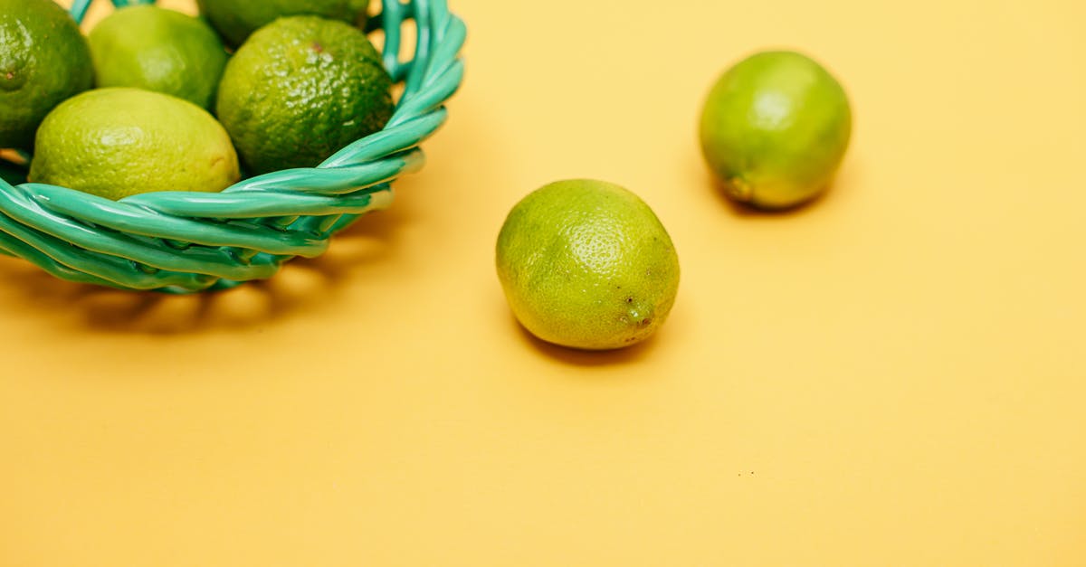 Post harvest treatment of organic limes vs conventional limes - Green Limes in a Green Woven Basket Post harvest treatment of organic limes vs conventional limes - Green Limes in a Green Woven Basket