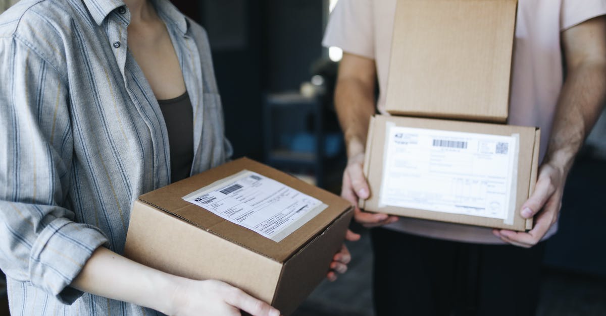 Pre packaged creme fraiche in quiche [closed] - Woman in Blue Denim Jacket Holding Brown Cardboard Box