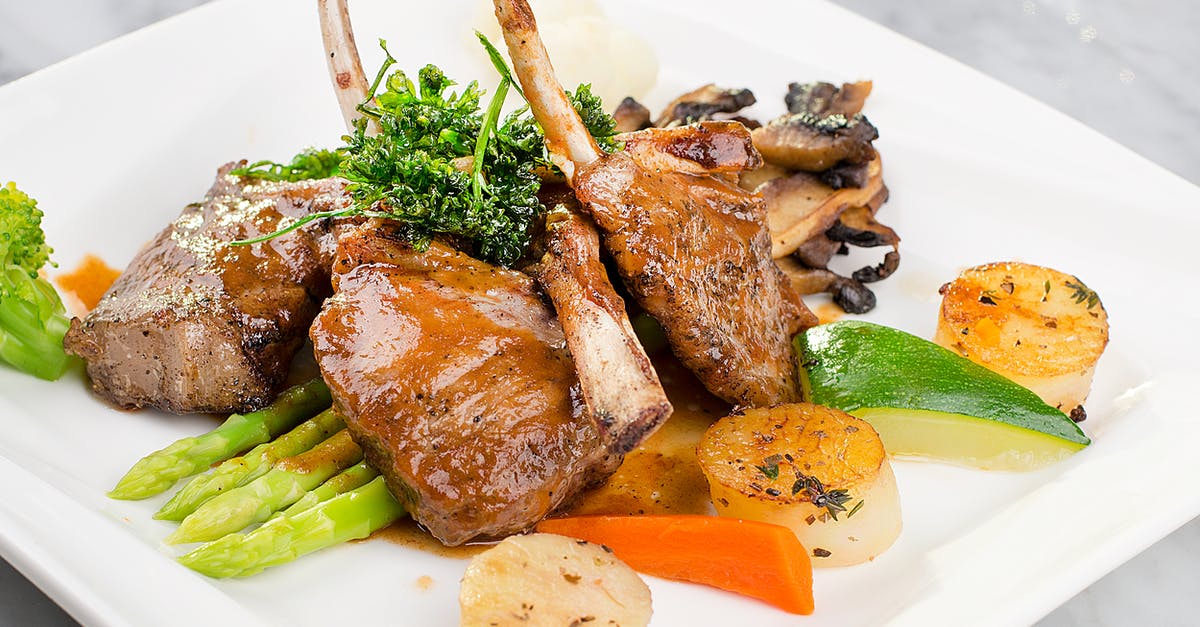Pre-blending Potatoes - Grilled Meat With Sliced Lemon and Green Vegetable on White Ceramic Plate Pre-blending Potatoes - Grilled Meat With Sliced Lemon and Green Vegetable on White Ceramic Plate