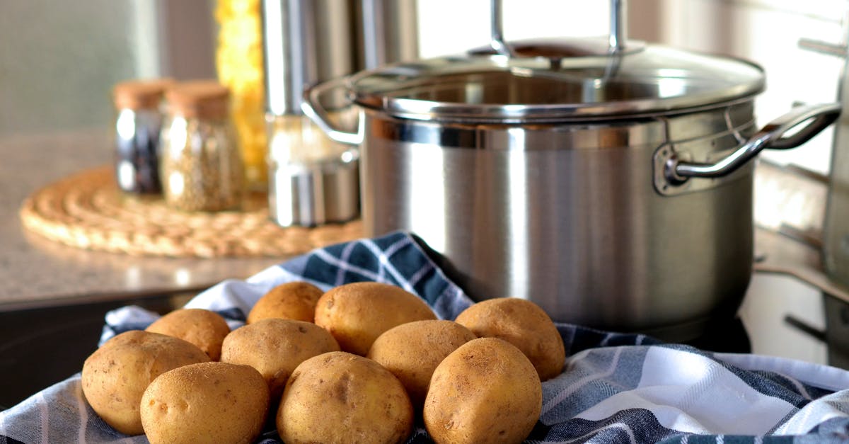 Pre-blending Potatoes - Potatoes Beside Stainless Steel Cooking Pot Pre-blending Potatoes - Potatoes Beside Stainless Steel Cooking Pot