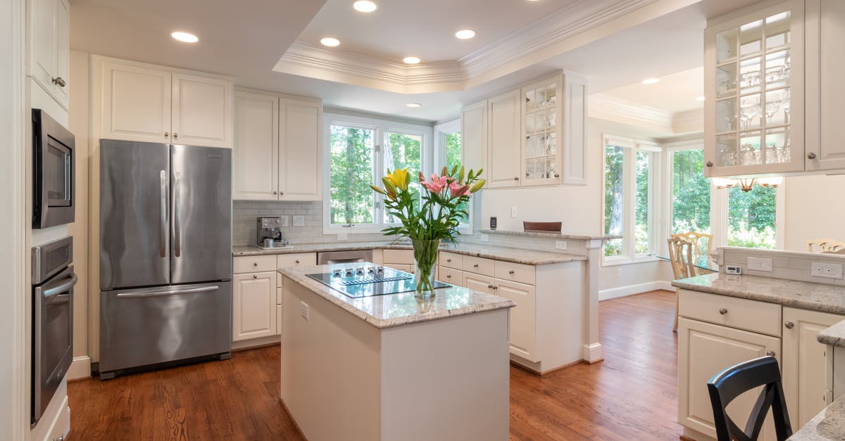 Preheating oven increases temperature? - Silver French Door Refrigerator Beside White Wooden Kitchen Cabinet Preheating oven increases temperature? - Silver French Door Refrigerator Beside White Wooden Kitchen Cabinet