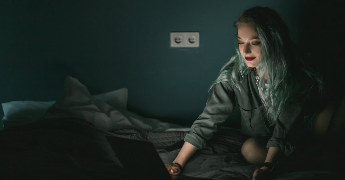 Preparing minced garlic the night before using them - Woman Using Laptop in the Dark Preparing minced garlic the night before using them - Woman Using Laptop in the Dark