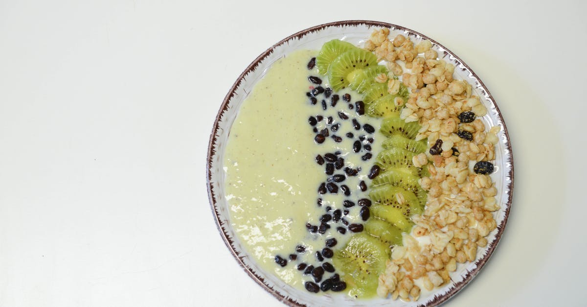 Preserving colour of mixed beans - Slice Kiwifruit and Nuts on Plate Preserving colour of mixed beans - Slice Kiwifruit and Nuts on Plate