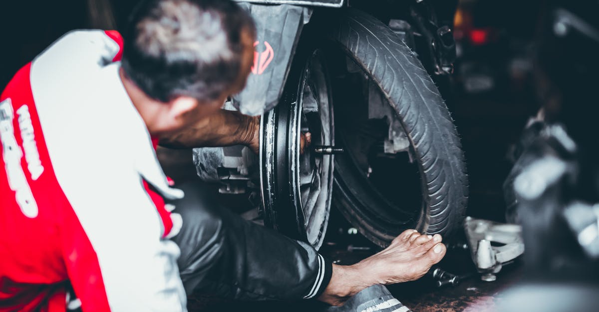 Pressure cooker missing a part. How do I fix it? - Man Changing a Rear Tire of a Motor Scooter Pressure cooker missing a part. How do I fix it? - Man Changing a Rear Tire of a Motor Scooter