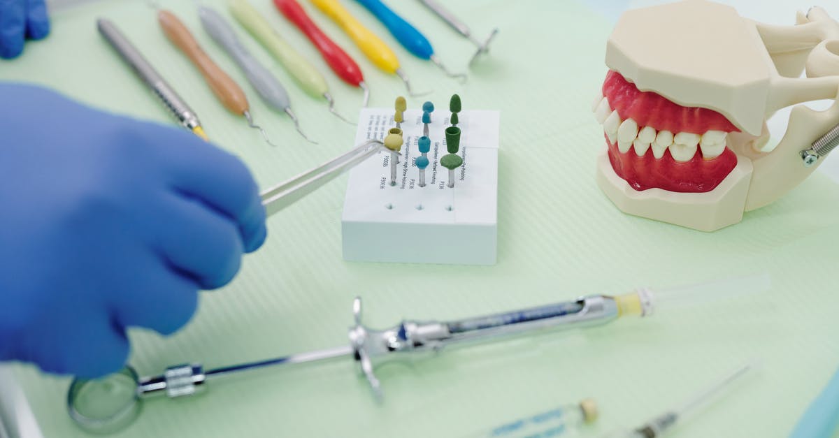 Prevent scrambled eggs from sticking to stainless steel - From above of crop faceless orthodontist in latex gloves and tweezers working at medical table with cast jaw and set of syringes near periodontal scalers Prevent scrambled eggs from sticking to stainless steel - From above of crop faceless orthodontist in latex gloves and tweezers working at medical table with cast jaw and set of syringes near periodontal scalers