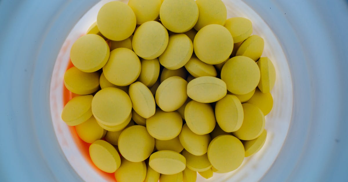 Prevent sticky residue from oiling seasoned pan before storage - Jar of yellow pills from above Prevent sticky residue from oiling seasoned pan before storage - Jar of yellow pills from above
