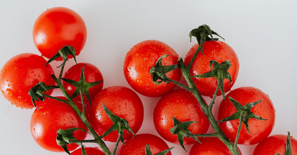 Preventing Diced Vegetables Added to Simmering Liquid From Becoming Mushy - Composition of red tomatoes with water drops Preventing Diced Vegetables Added to Simmering Liquid From Becoming Mushy - Composition of red tomatoes with water drops