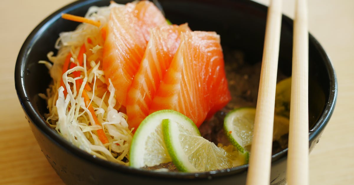 Process fresh salmon into Sushi / Sashimi salmon? - Slices of Salmon Sashimi with Slices of Lime on Black Bowl Process fresh salmon into Sushi / Sashimi salmon? - Slices of Salmon Sashimi with Slices of Lime on Black Bowl