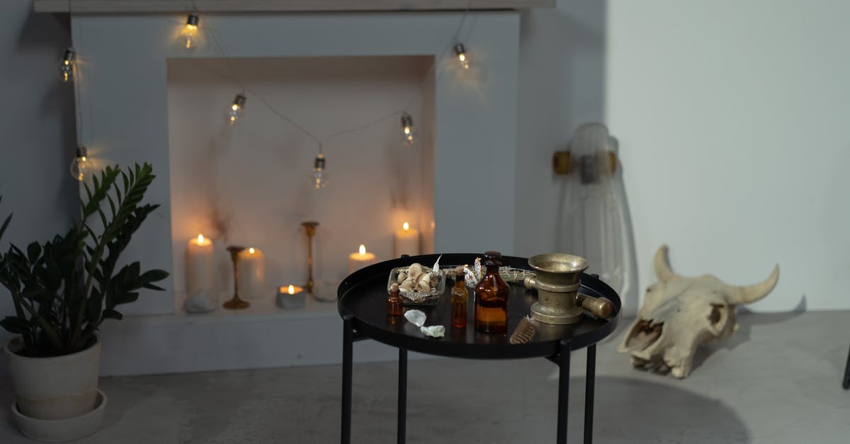Proper cow bones to prepare holodets - Bottles on Black Round Table in the Room with Fireplace and Cow Skull Proper cow bones to prepare holodets - Bottles on Black Round Table in the Room with Fireplace and Cow Skull