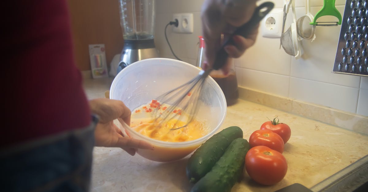 Proper preparation of veggies for an egg scramble - A Person Beating Eggs Using Wire Whisk Proper preparation of veggies for an egg scramble - A Person Beating Eggs Using Wire Whisk