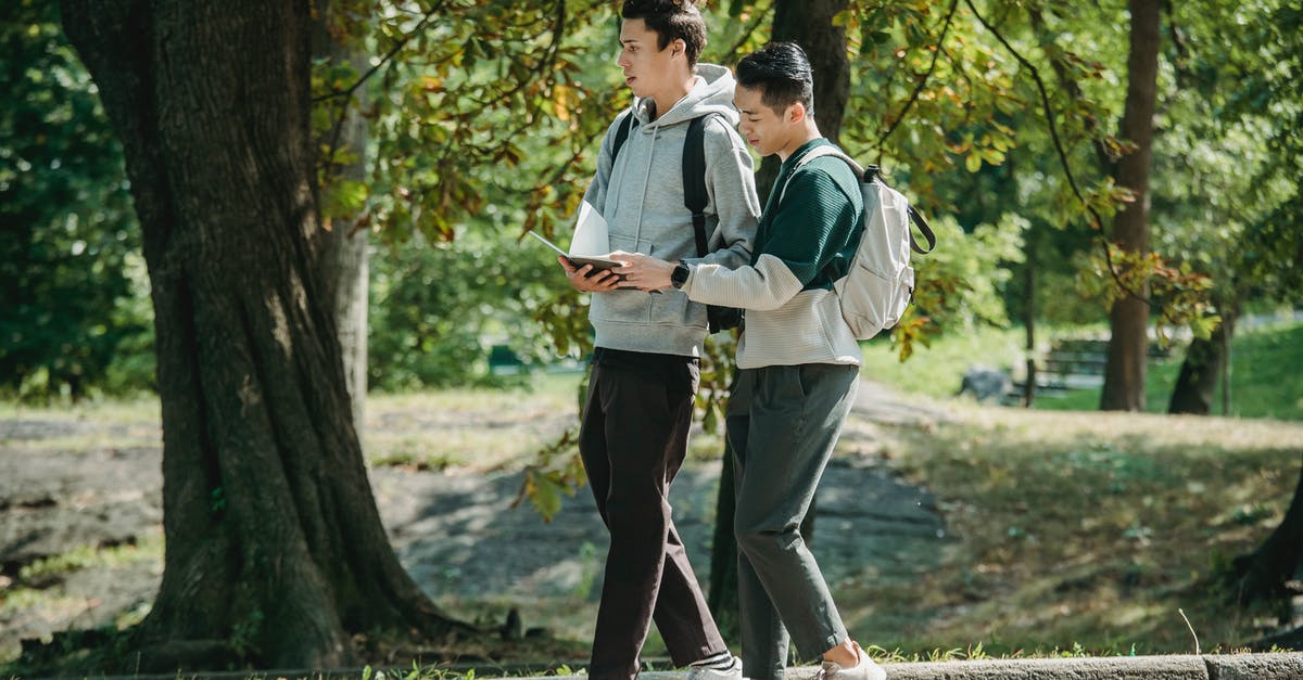 Proper way to prepare shrimp? - Side view of young stylish diverse male friends in casual outfits and backpacks walking together in path in park and preparing for exam Proper way to prepare shrimp? - Side view of young stylish diverse male friends in casual outfits and backpacks walking together in path in park and preparing for exam