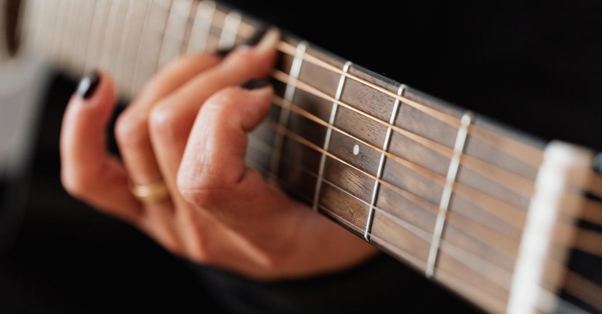 Pumpkin Roll Technique - Crop faceless woman practicing classical guitar technique